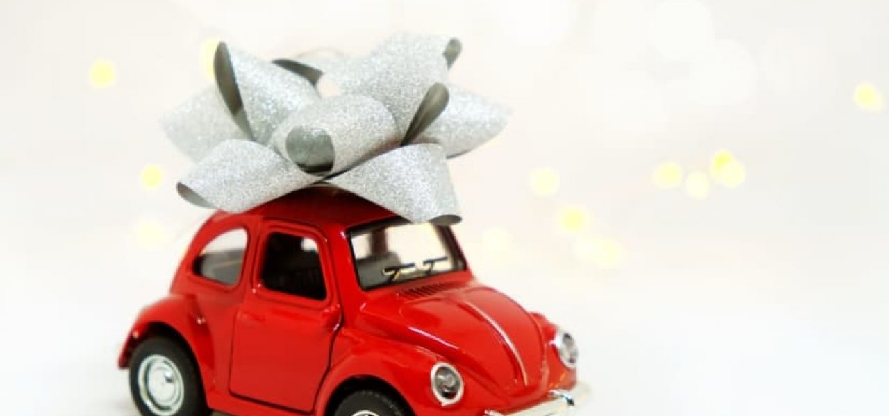 red toy car wrapped ribbon